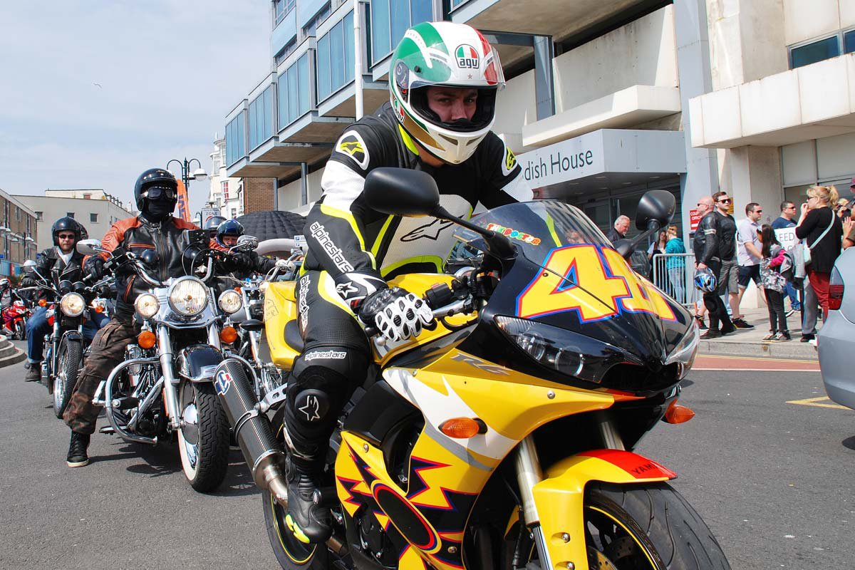 Guy with replica Rossi bike wearing leathers